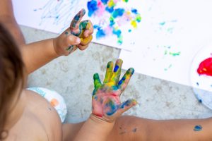 image of a child finger painting
