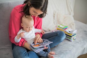 image of mother reading to infant