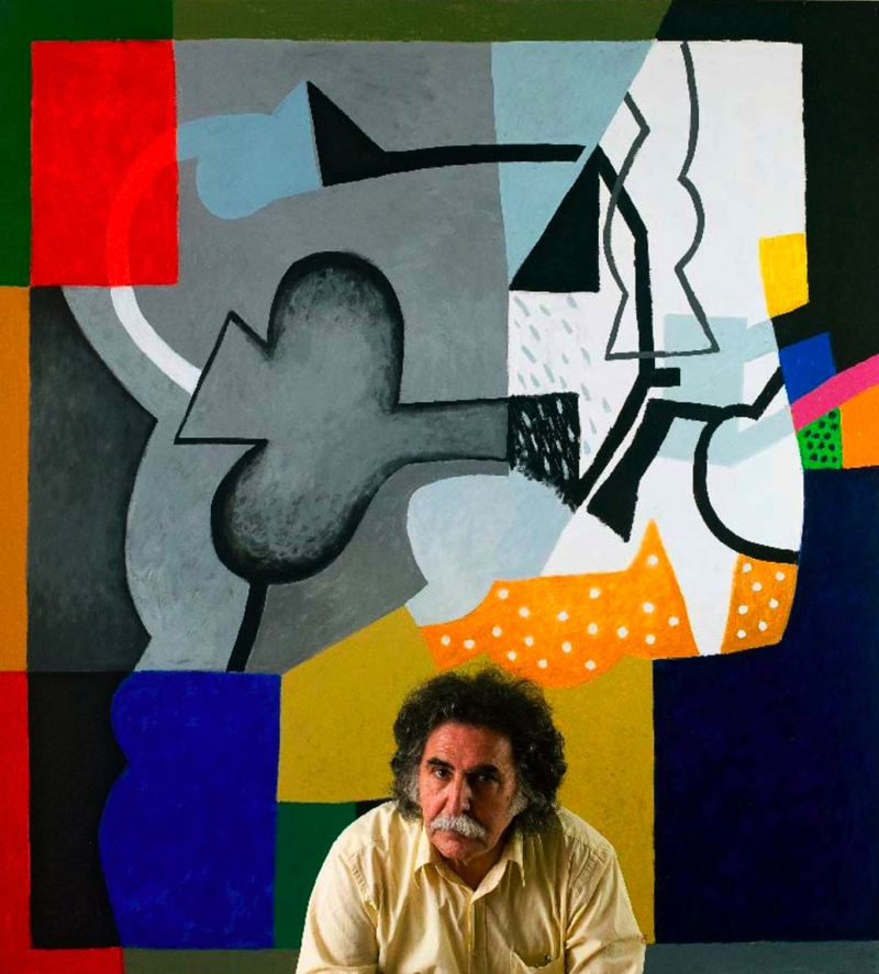 photo of painter Dia al-Azzawi in front of his painting