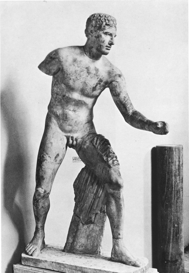 Black and white photo of a statue of Apollan Warrior at the Temple of Apollo with a missing right arm.