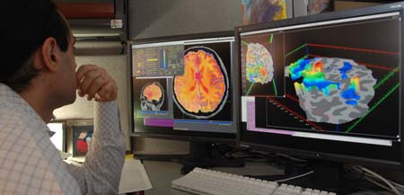 Picture showing a researcher checking MRI images.