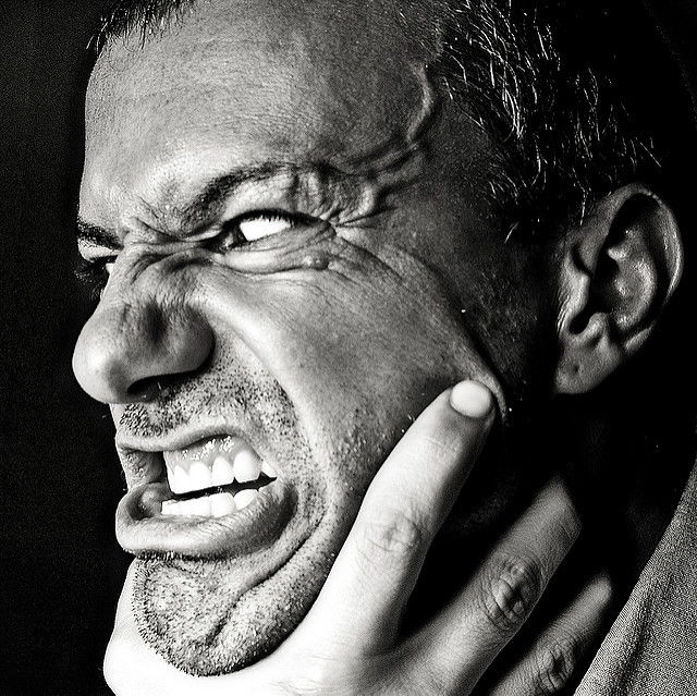 Image of man's face in a show of aggression