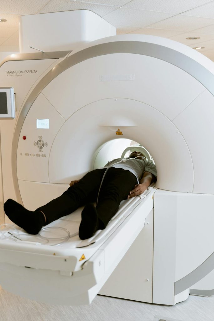 Photo of a person in an MRI scanner head first.