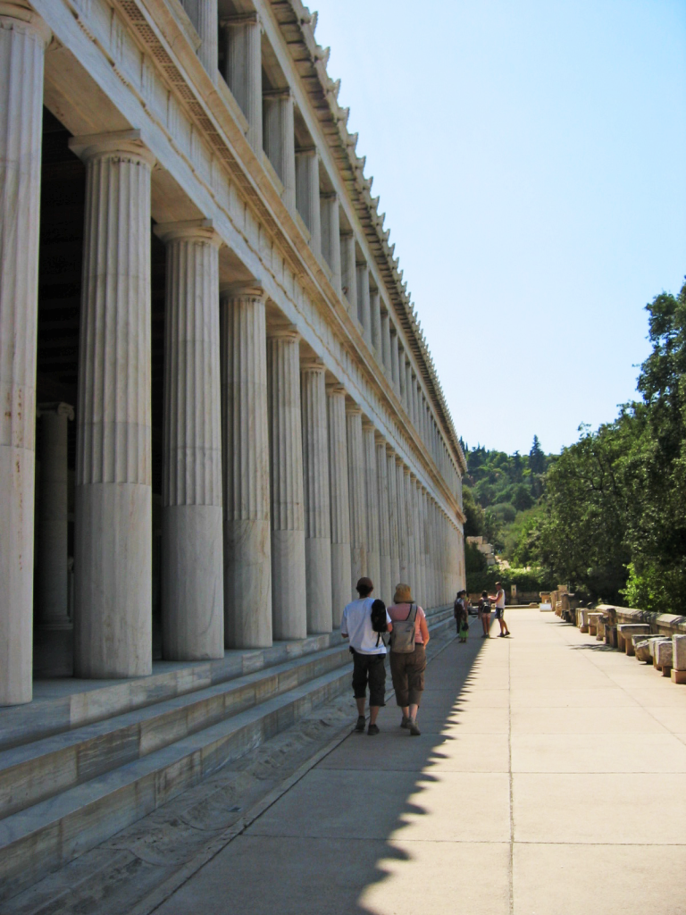 Photo of people walking at the Stoa of Attalos.