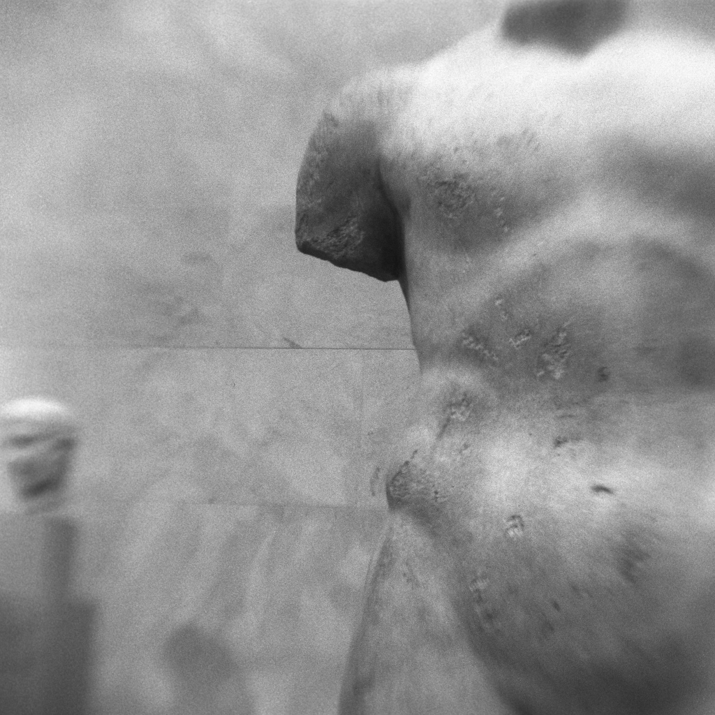 Black and white cropped torso of a statue at the MET in New York City