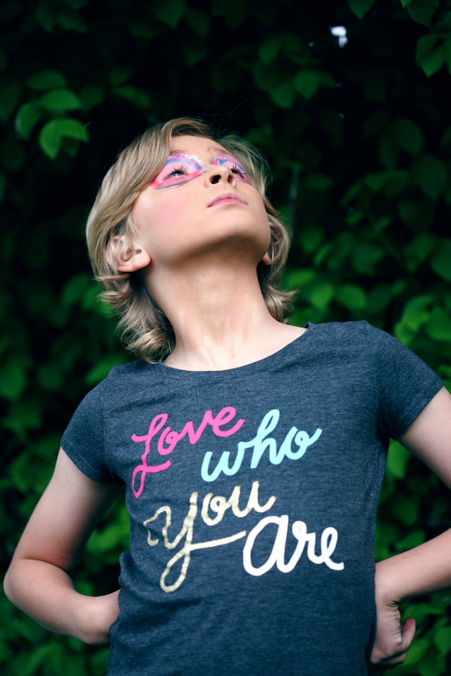image of a young person with make up and shirt with "Love who you are".