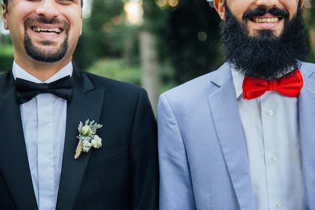 Image of two men next to each other smiling