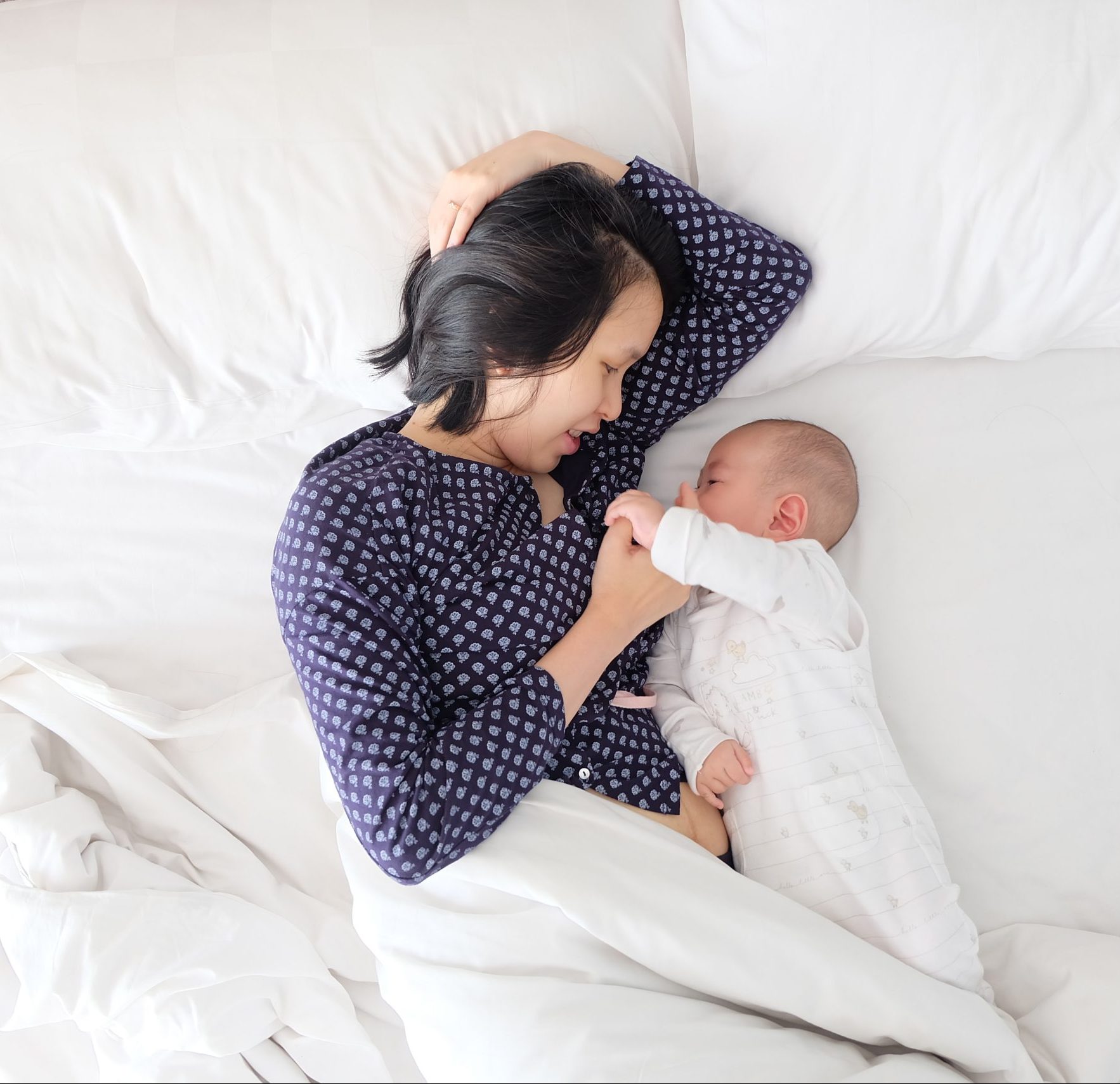 image of mother in bed with infant