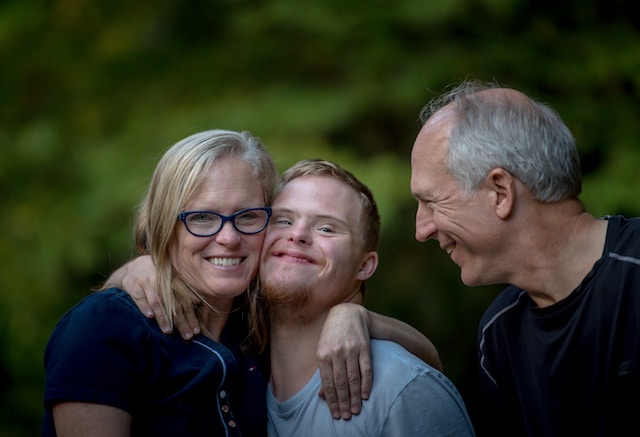 Image of parents and a child with disability