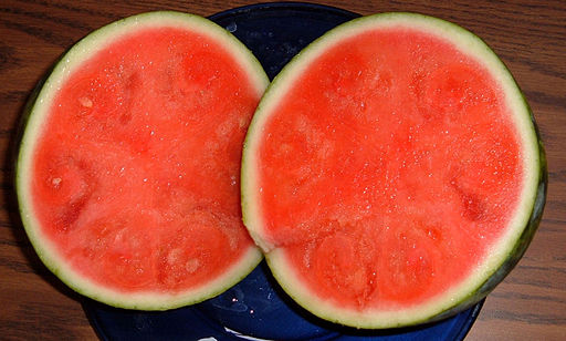 A seedless watermelon cut in half.