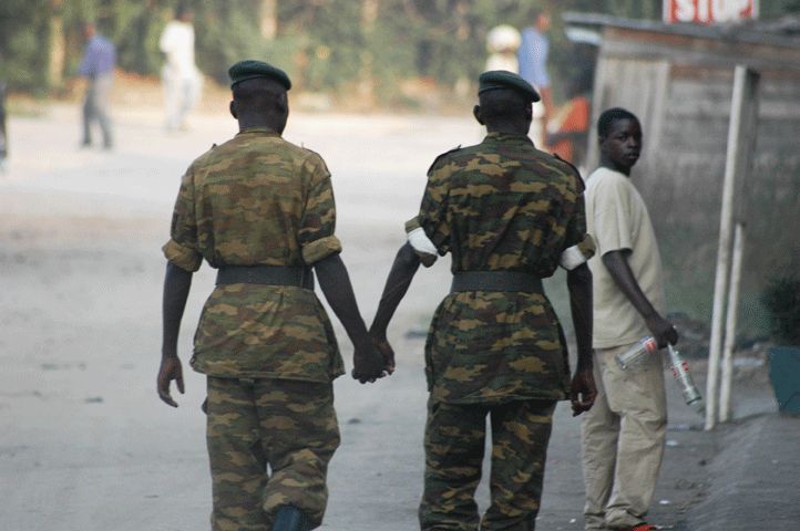 Image of two soldier holding hands