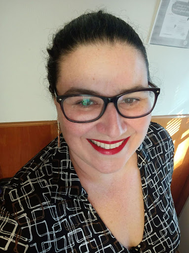 Photo of brown hair woman wearing glasses