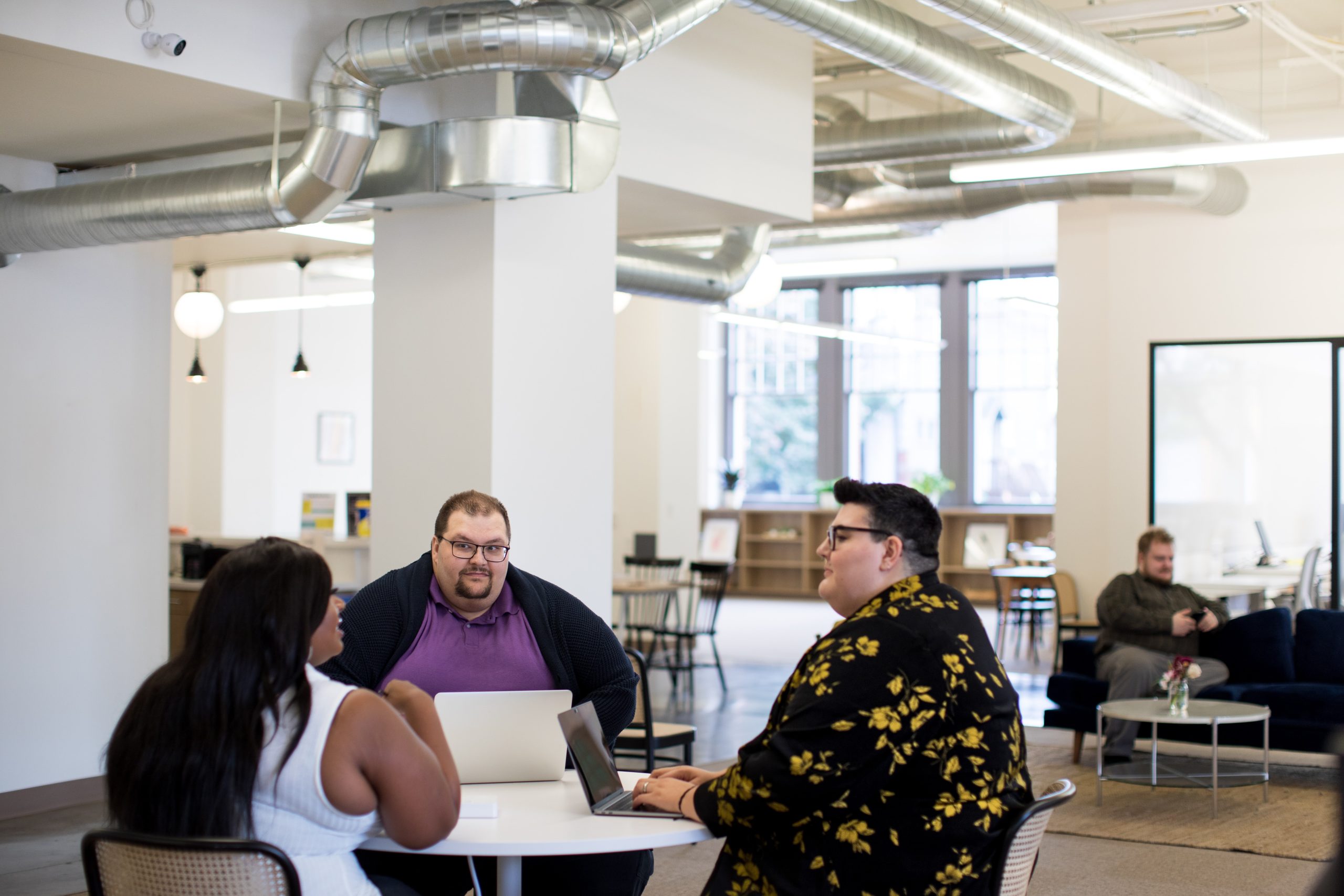 image of four people sitting