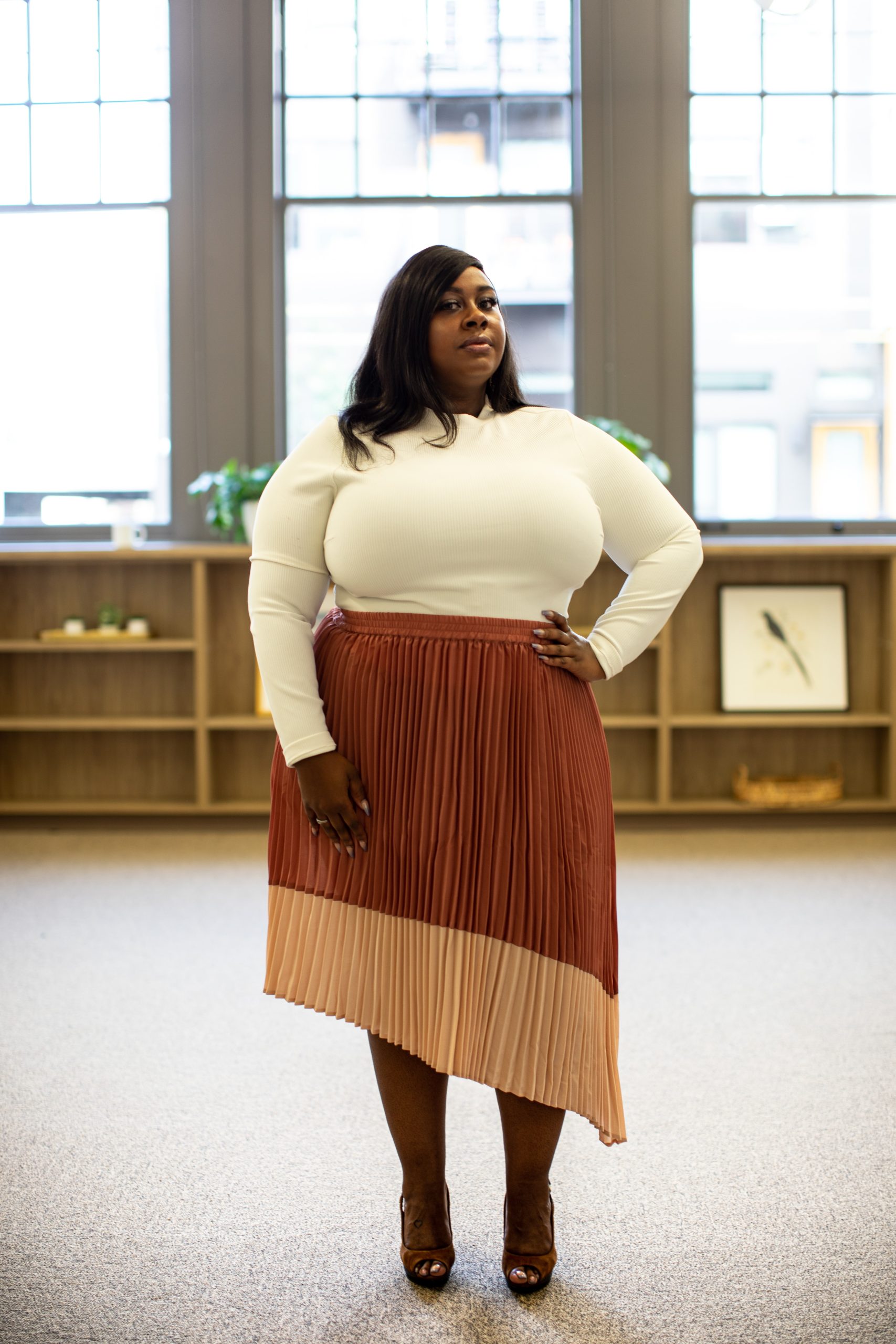 woman standing with hand on hip